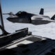 an_f-35b_lightning_ii_attack_jet_flies_alongside_a_kc-130j_tanker_aircraft.jpg