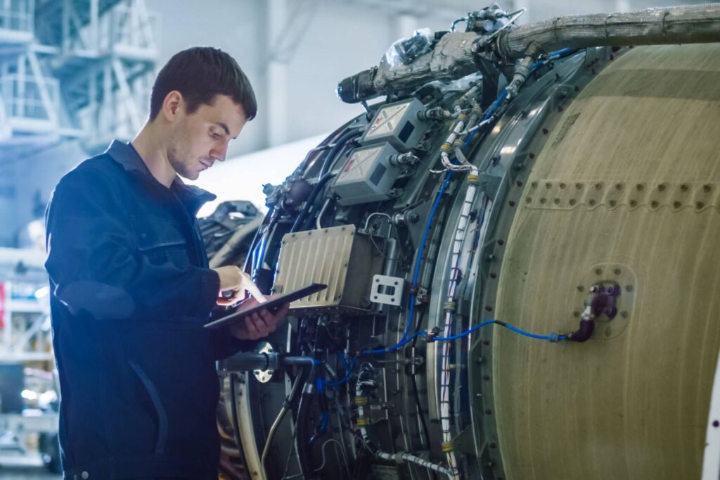 an_mro_technician_using_a_tablet_to_check_an_engine-5.jpg