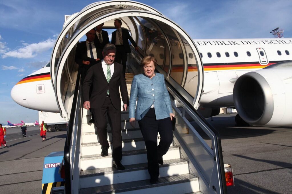 angela-merkel-stepping-out-of-plane-1.jpg