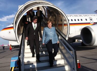 angela-merkel-stepping-out-of-plane-1.jpg