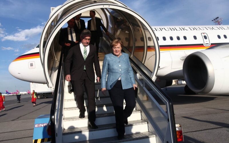 angela-merkel-stepping-out-of-plane-1.jpg