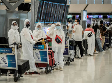 asian_passengers_in_protective_overall_and_masks-1.jpg