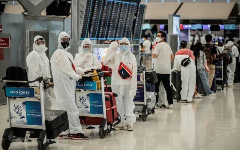 asian_passengers_in_protective_overall_and_masks-1.jpg