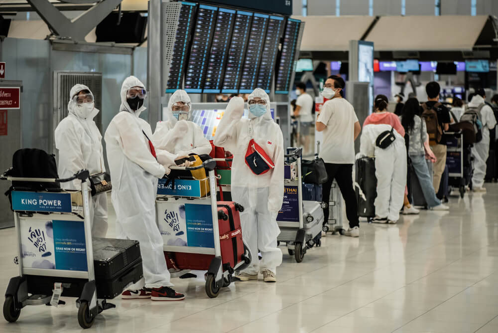 asian_passengers_in_protective_overall_and_masks-1.jpg