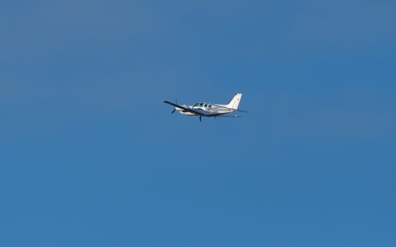 Beechcraft Baron 58 propeller plane leaving from runway