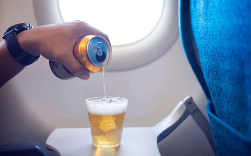 beer_being_poured_into_a_cup_onboard_a_plane.jpg