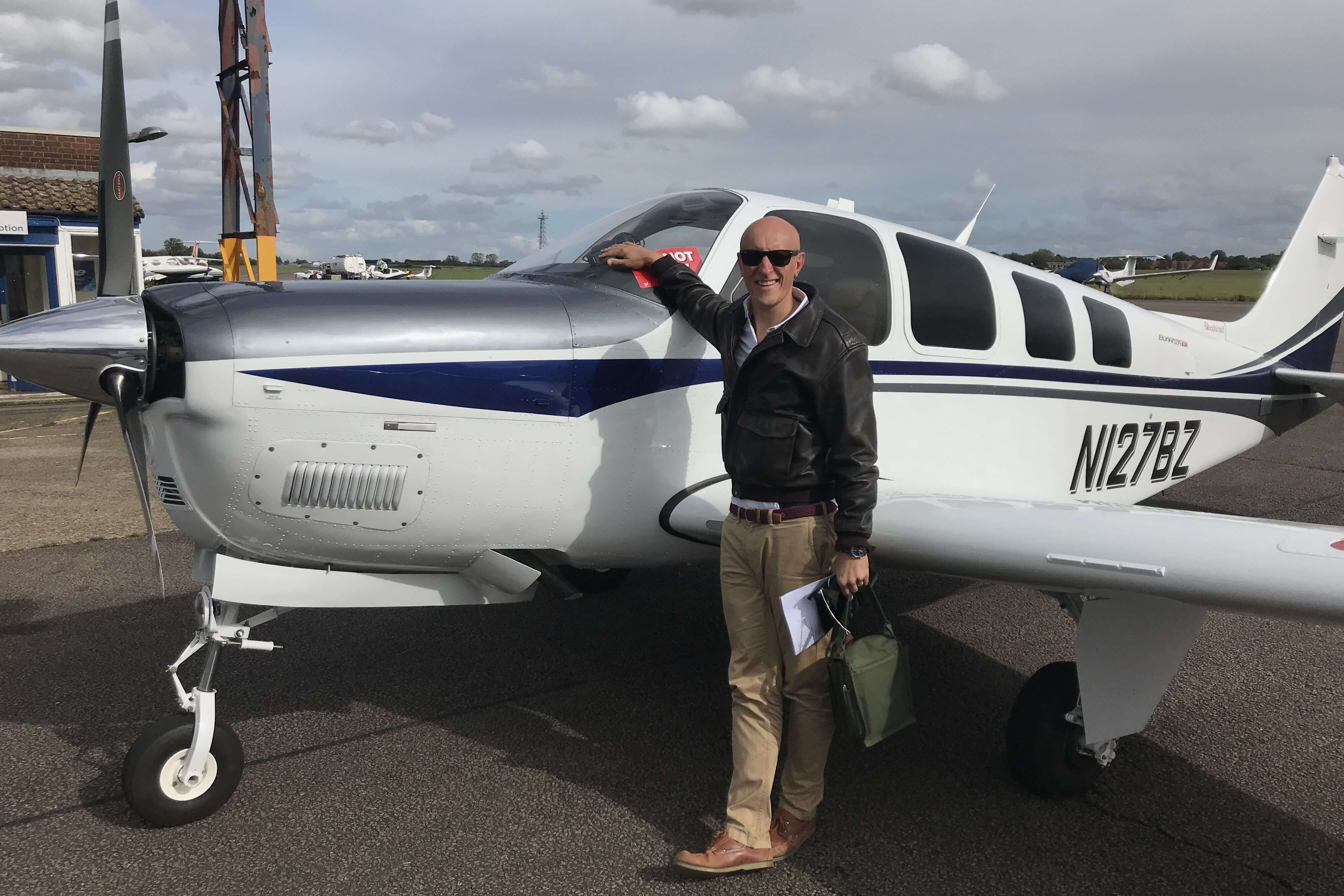 Ben Griffiths standing next to Beechcraft Bonanza