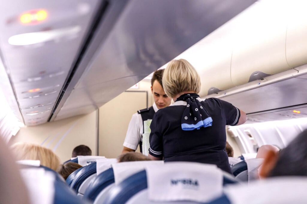 cabin_crew_serving_passengers_on_a_finnair_flight.jpg