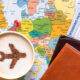 capuccino_passpord_and_a_boarding_pass_over_the_map_of_europe.jpg