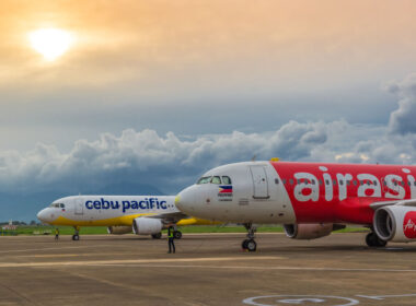 cebu_pacific_and_air_asia_aircraft_parked_at_an_airport.jpg