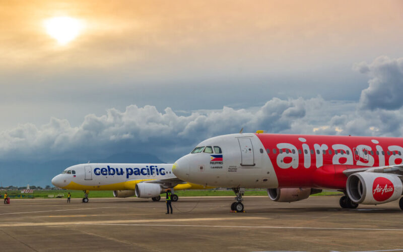 cebu_pacific_and_air_asia_aircraft_parked_at_an_airport.jpg