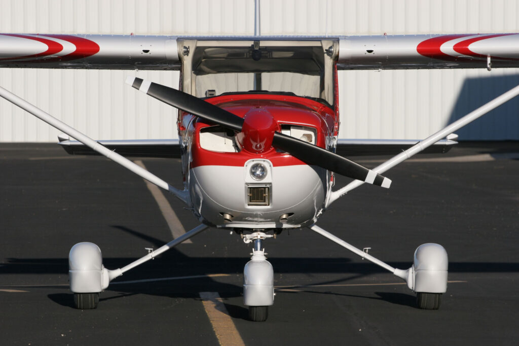 The Cessna 150 Aerobat A150M flying formation desert mountains