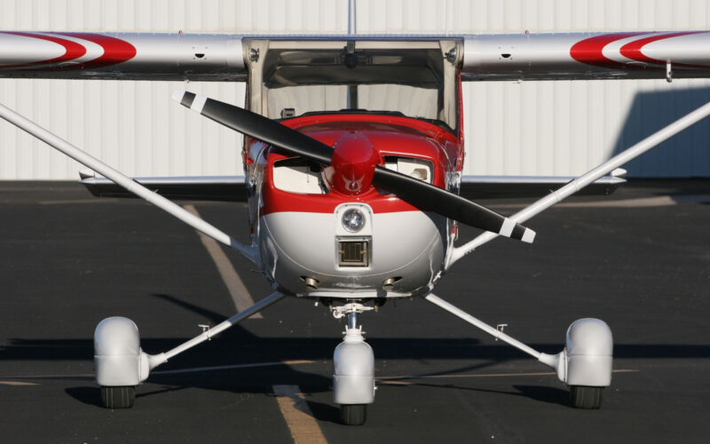 The Cessna 150 Aerobat A150M flying formation desert mountains