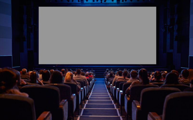 Empty cinema screen with audience