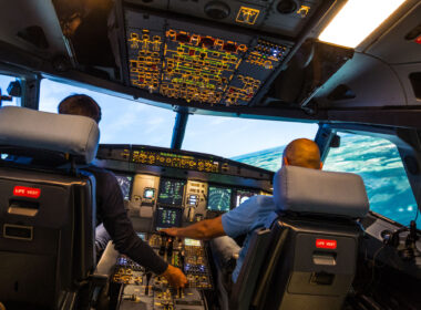 modern airbus airplane cockpit with pilots during a training session in a full flight simulator