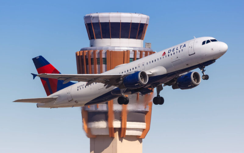 delta_aircraft_in_front_of_atc_tower.jpg