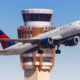 delta_aircraft_in_front_of_atc_tower.jpg