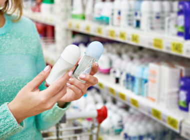 Woman in shop chooses deodorant closeup