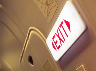 exit sign illuminated so passengers can see the exit clearly