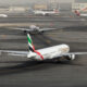 emirates_boeing_777_taxiing_at_a_busy_dubai_international_airport_dxb.jpg