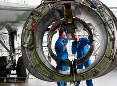 engineers_in_uniforms_inspecting_an_engine_casing.jpg