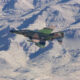 F 4 Phantom jet in a white snowy mountains background