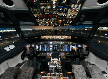 Full view of cockpit modern Boeing aircraft before take-off. Airplane is ready to fly. Night shot in cabin. Safety flight