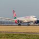 kenya_airways_5y-kze_boeing_787-8_dreamliner_landing_at_schiphol_airport.jpg