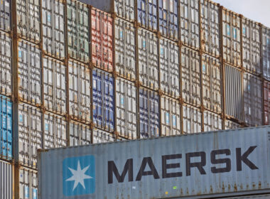 maersk_containers_stacked_in_a_shipping_terminal.jpg