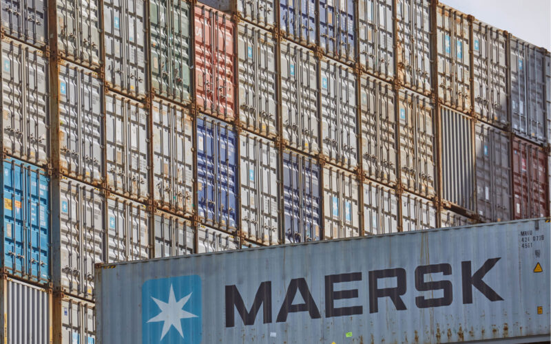 maersk_containers_stacked_in_a_shipping_terminal.jpg