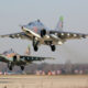 pair_of_russian_sukhoi_su-25_attack_aircraft_taking_off.jpg