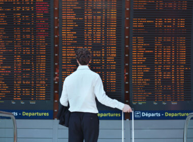 passenger_checking_flights_in_a_french_airport.jpg