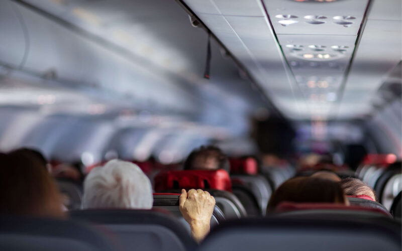 passengers_on_aircraft_holding_airplane_seat.jpg