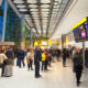 people_waiting_for_arrivals_in_heathrow_airport.jpg