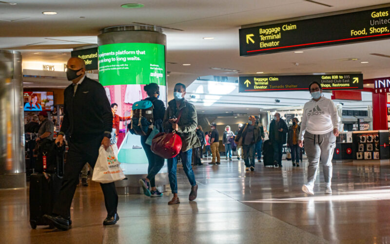 people_wearing_mask_in_denver_international_airport.jpg