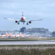 plane_landing_at_gatwick_against_backdrop_of_parked_planes.jpg