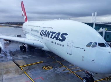 Qantas aircraft waiting for passengers during rainy day at Melbourne international airport.