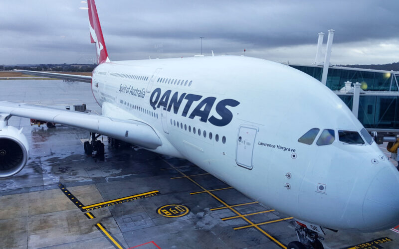 Qantas aircraft waiting for passengers during rainy day at Melbourne international airport