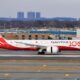 qantas_boeing_787-9_dreamliner_vh-znj_100th_anniversary_livery_landing_at_jfk_airport-1.jpg