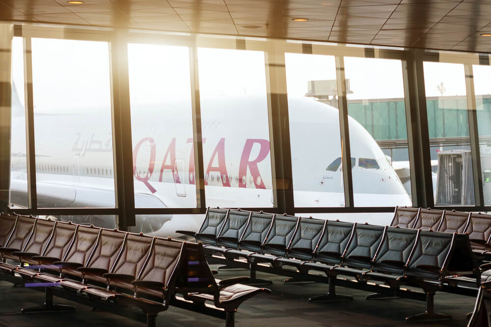 qatar_airways_airbus_a380_parked_at_doha_international_airport_gate-1.jpg