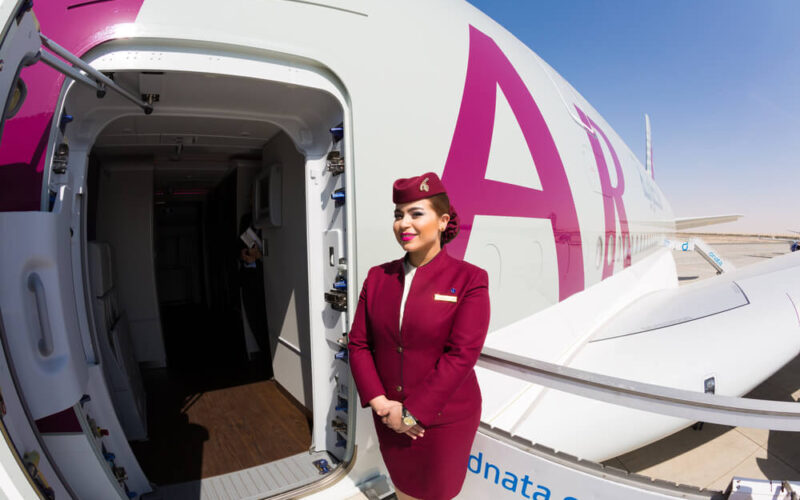 qatar_airways_flight_attendant_welcoming_passengers_on_board_an_airbus_a380-1.jpg