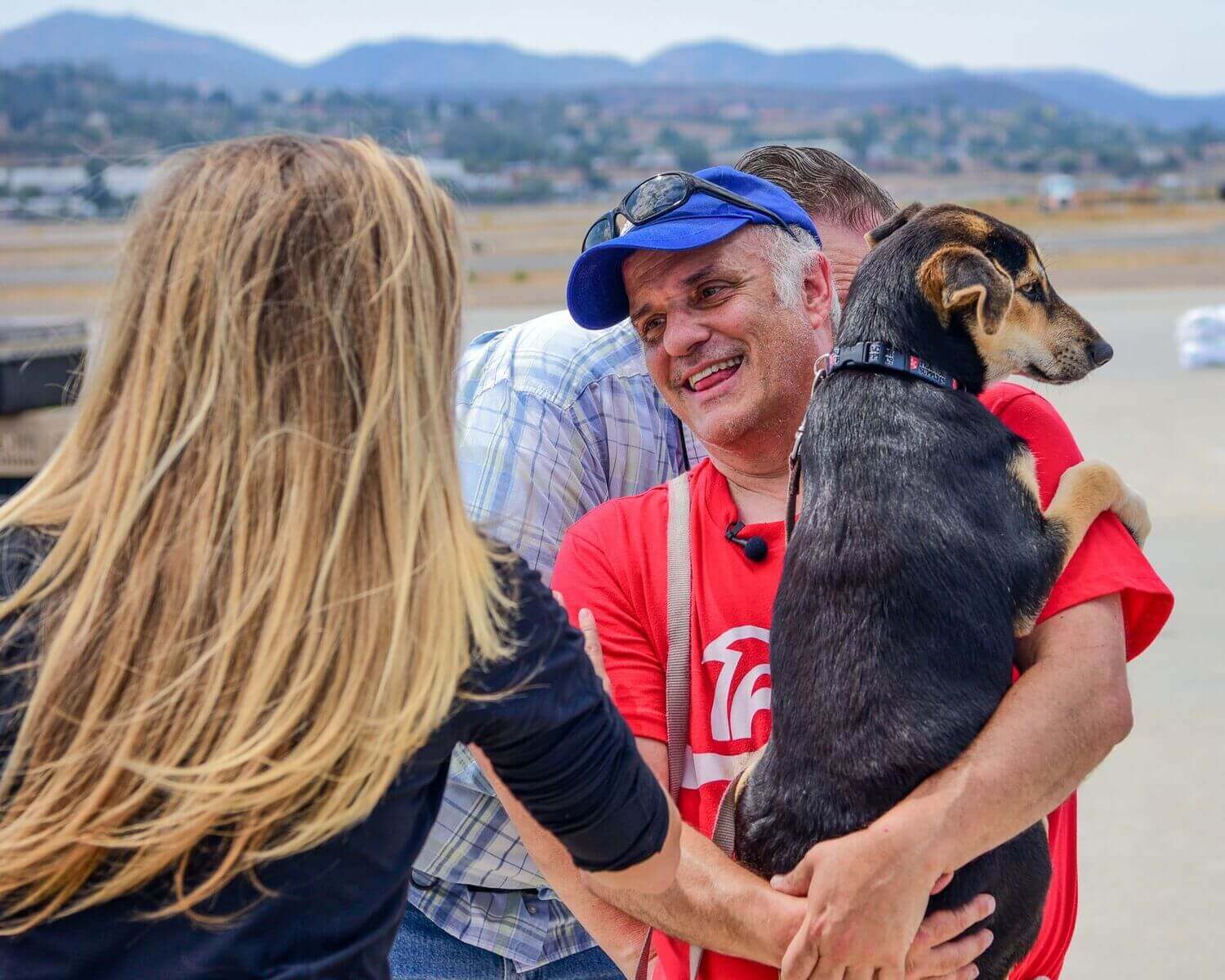 Wings of Rescue Ric carrying a dog