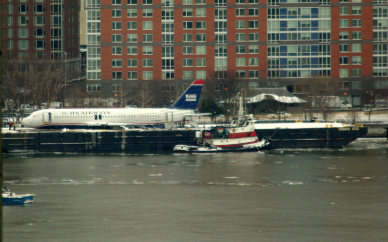 US Airways Flight 1549 resting on a barge next to Battery Park City after being raised out of the Hudson River