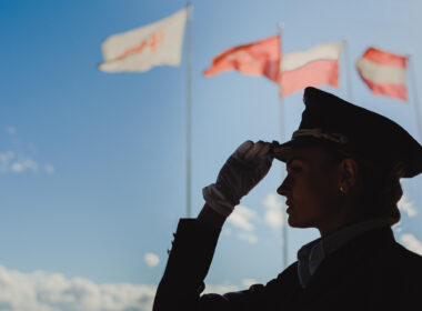 silhouette_of_a_female_pilot_with_flags_in_the_background.jpg