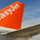 the_easyjet_logo_is_seen_on_the_tail_of_one_of_its_planes.jpg