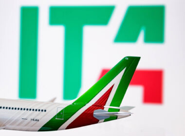 the_ita_logo_is_seen_against_an_alitalia_plane_model.jpg