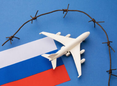 toy_aircraft_with_a_russia_flag_and_barbed_wire.jpg