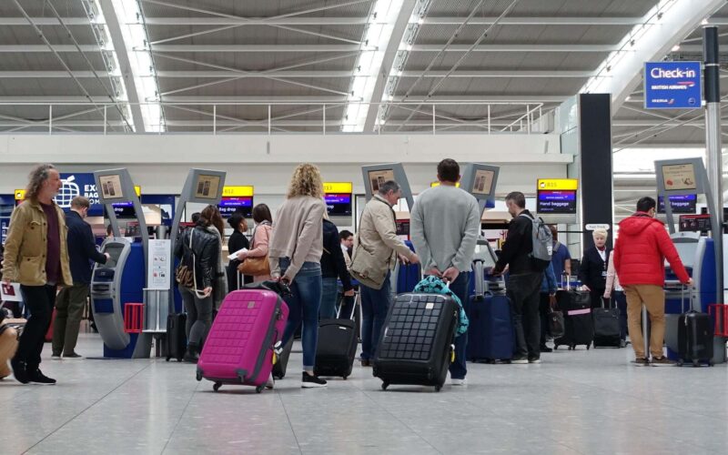 travellers_at_a_check_in_at_heathrow_airport_1.jpg