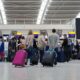 travellers_at_a_check_in_at_heathrow_airport_1.jpg