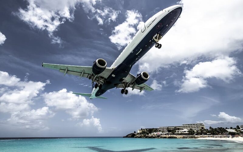 white-aircraft-above-beach-shoreline-at-daytime.jpg